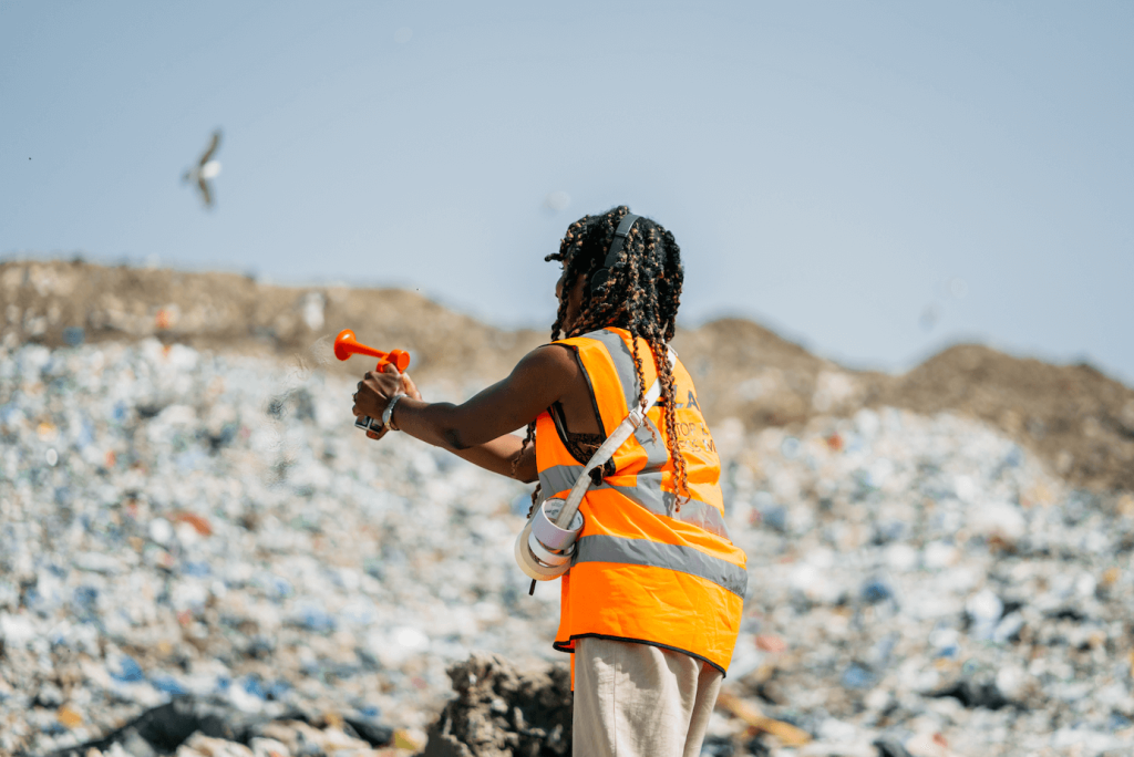 BTS of Greenpeace campaign, producer on set in a high vis