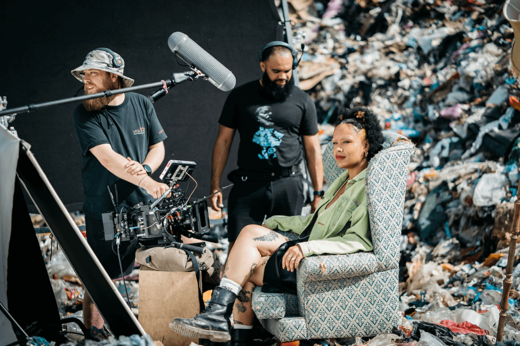 BTS of Greenpeace campaign, film crew with talent at landfill site